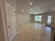 Open-concept living room with high ceilings and tile flooring at 4528 Sw 90Th Lane Rd, Ocala, FL 34476