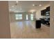 Open-concept living room and kitchen featuring a large island and stainless steel appliances at 4528 Sw 90Th Lane Rd, Ocala, FL 34476