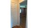 Cozy bedroom with wood-look flooring, natural light, and a ceiling fan at 9090 Se 135Th Loop, Summerfield, FL 34491