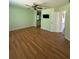 Open bedroom with a ceiling fan and view of an attached bathroom at 9090 Se 135Th Loop, Summerfield, FL 34491