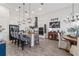 Modern kitchen featuring pendant lighting, bar stool seating, and stainless steel appliances for cooking at 9307 San Jose Blvd, Howey In The Hills, FL 34737