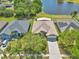 Beautiful home with a large backyard, landscaping, and a view of the community pond at 1201 Creekview Ct, St Cloud, FL 34772