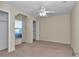 Bright bedroom with carpet, ceiling fan, closet, and a window for natural light at 1201 Creekview Ct, St Cloud, FL 34772