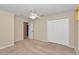 Bedroom featuring carpet, a ceiling fan, double closet, and a window at 1201 Creekview Ct, St Cloud, FL 34772