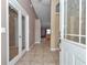 Tiled entryway leading into home with decorative doors and an open floor plan at 1201 Creekview Ct, St Cloud, FL 34772