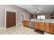 Bright kitchen with tile floor and stainless steel dishwasher at 1201 Creekview Ct, St Cloud, FL 34772