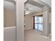 Carpeted living room with sliding glass doors and high ceilings at 1201 Creekview Ct, St Cloud, FL 34772