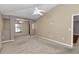 Bright living room with ceiling fan and connecting rooms at 1201 Creekview Ct, St Cloud, FL 34772