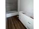 Bathroom with new vanity, tub, and wood-look flooring at 2147 Sw 3Rd St, Ocala, FL 34471