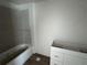 Bathroom in progress with a tub, white walls, and an unfinished vanity at 2147 Sw 3Rd St, Ocala, FL 34471