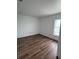Clean, newly painted bedroom with new wood-look flooring and natural light at 2147 Sw 3Rd St, Ocala, FL 34471