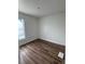 Clean, newly painted bedroom with new wood-look flooring and ample natural light at 2147 Sw 3Rd St, Ocala, FL 34471