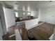 Spacious living room featuring wood-look floors, fresh paint, recessed lighting, and natural light at 2147 Sw 3Rd St, Ocala, FL 34471