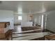Spacious living room with wood-look flooring, fresh paint, and natural light at 2147 Sw 3Rd St, Ocala, FL 34471