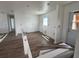 Bright living room featuring wood-look floors, fresh paint, recessed lighting, and doorway at 2147 Sw 3Rd St, Ocala, FL 34471