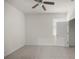 Bright bedroom features neutral carpet, ceiling fan and closet at 5530 Nw 40Th Loop, Ocala, FL 34482