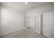 Carpeted bonus room featuring light walls and double glass doors at 5530 Nw 40Th Loop, Ocala, FL 34482