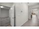 Hallway view featuring tile flooring and access to multiple rooms at 5530 Nw 40Th Loop, Ocala, FL 34482