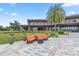 Relaxing outdoor lounge area with stylish seating, vibrant plants, and lush landscaping at 5530 Nw 40Th Loop, Ocala, FL 34482