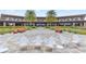Inviting outdoor patio with manicured landscaping and ample seating for relaxing at 5530 Nw 40Th Loop, Ocala, FL 34482