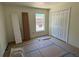 Bright bedroom featuring a closet and a large window at 714 Nw 2Nd St, Ocala, FL 34475