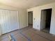 Bedroom with closet and door with flooring prepped at 714 Nw 2Nd St, Ocala, FL 34475