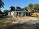 New house with white siding, covered porch, and front yard ready for landscaping at 714 Nw 2Nd St, Ocala, FL 34475