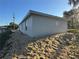 A newly built single-story house featuring stucco with windows under a bright blue sky at 714 Nw 2Nd St, Ocala, FL 34475