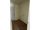 An unfinished laundry room showing a white door and connections for a washer and dryer at 714 Nw 2Nd St, Ocala, FL 34475