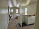 Open-concept living room with vaulted ceiling and new kitchen cabinets at 714 Nw 2Nd St, Ocala, FL 34475