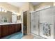 Bathroom featuring a double sink vanity and glass enclosed shower at 9230 Sw 66Th Loop, Ocala, FL 34481