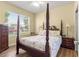 Comfortable bedroom with natural light and view to the outside at 9230 Sw 66Th Loop, Ocala, FL 34481