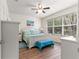 This bedroom features a large window providing bright natural light at 9230 Sw 66Th Loop, Ocala, FL 34481