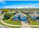 Beautiful single-story home featuring a well-manicured lawn, two-car garage, and attractive blue exterior at 9230 Sw 66Th Loop, Ocala, FL 34481