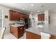 Spacious kitchen with stainless steel appliances, dark wood cabinets, and ample counter space at 9230 Sw 66Th Loop, Ocala, FL 34481