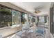 Relaxing screened lanai with comfortable seating and a beautiful view of the backyard at 9230 Sw 66Th Loop, Ocala, FL 34481