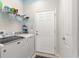 Clean laundry room with modern washer and dryer and plenty of storage at 9230 Sw 66Th Loop, Ocala, FL 34481