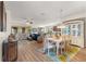 Spacious living room featuring an open layout with wood floors and a dining area at 9230 Sw 66Th Loop, Ocala, FL 34481