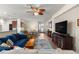 Spacious living room with stylish furnishings, a ceiling fan, and an open layout perfect for entertaining at 9230 Sw 66Th Loop, Ocala, FL 34481
