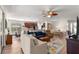 Open-concept living area with modern furnishings, hardwood floors, and abundant natural light at 9230 Sw 66Th Loop, Ocala, FL 34481