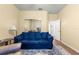 Comfortable living room featuring a sofa and view to the outside at 9230 Sw 66Th Loop, Ocala, FL 34481