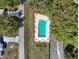 A high angle view of a pristine community pool providing relaxation and leisure, surrounded by well-maintained grounds at 10740 Sw 62Nd Avenue Rd, Ocala, FL 34476