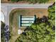 An elevated view of the shuffleboard courts surrounded by lush greenery promoting active recreation in the community at 10740 Sw 62Nd Avenue Rd, Ocala, FL 34476