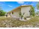 Backyard corner showing siding, landscaping, plants and a patio at 10954 Sw 83Rd Ct, Ocala, FL 34481