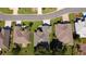 A picturesque aerial shot, features the home's landscaping amidst a residential setting at 13968 Se 96Th Cir, Summerfield, FL 34491