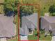Birds eye view of a well-maintained home with neutral toned roof and surrounding landscaping at 13968 Se 96Th Cir, Summerfield, FL 34491