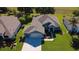 An elevated view of a neighborhood home, showcasing its well-kept lawn and manicured landscaping at 13968 Se 96Th Cir, Summerfield, FL 34491