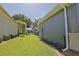 Well-maintained backyard featuring lush green grass and landscaping, perfect for outdoor activities and relaxation at 13968 Se 96Th Cir, Summerfield, FL 34491