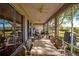 Patio showing view, chairs, table, and the outside grill at 13968 Se 96Th Cir, Summerfield, FL 34491
