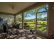 Covered patio featuring brick flooring, screen windows, and a view of the yard at 13968 Se 96Th Cir, Summerfield, FL 34491